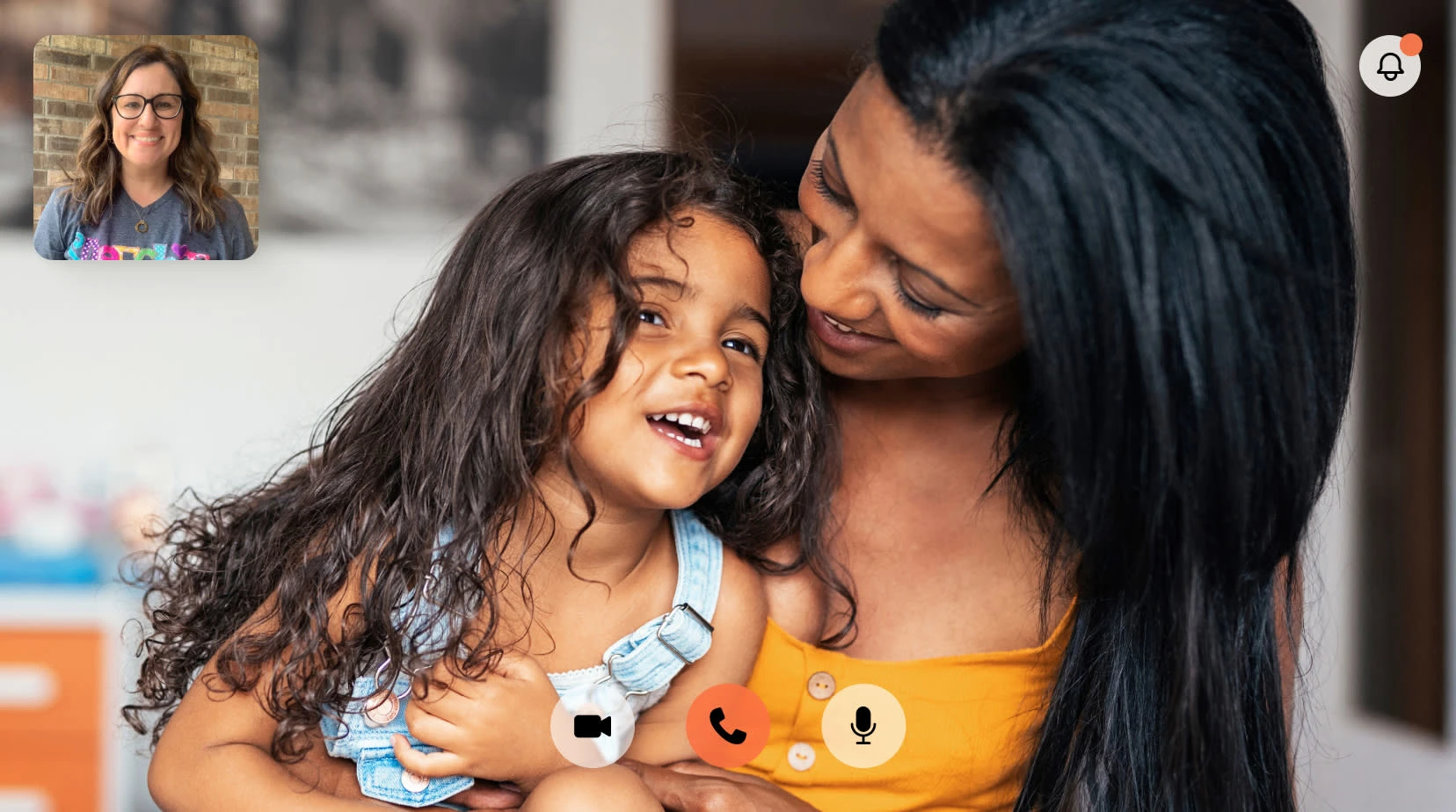 A parent and child in an online speech therapy video session
